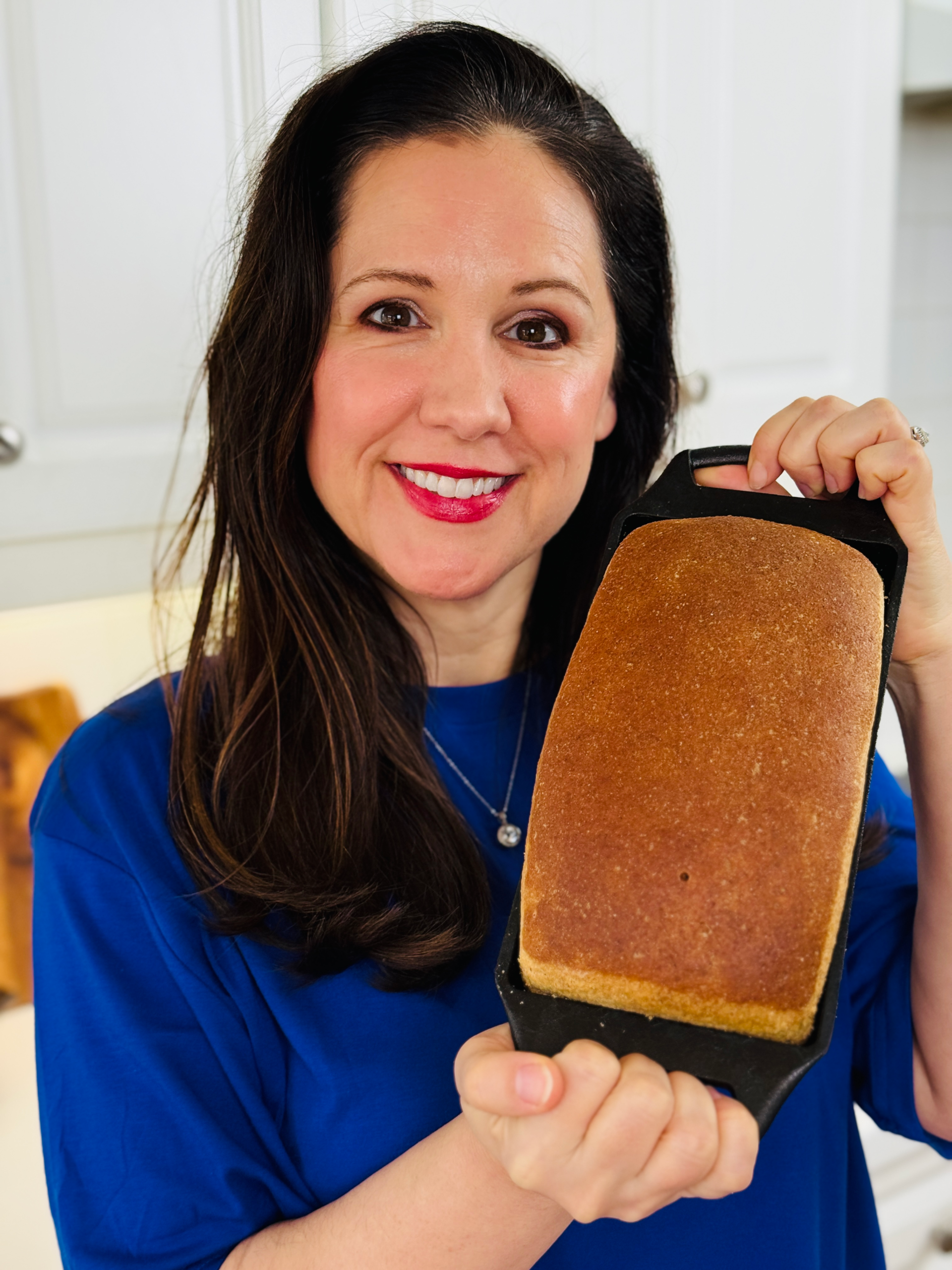 Ashlin holding fresh sourdough bread