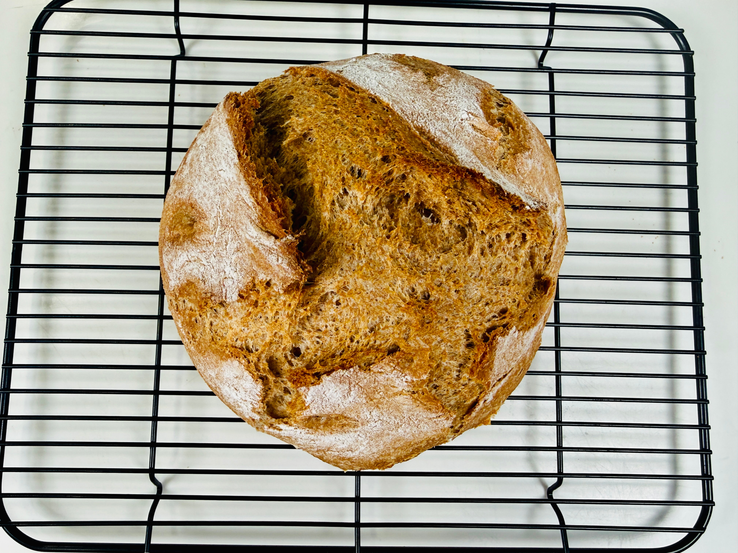 Spelt sourdough bread on cooling rack